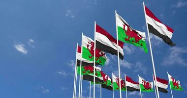 Wales and Yemen Flags Waving Together in the Sky, Seamless Loop in Wind, Space on Left Side for Design or Information, 3D Rendering video