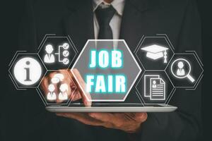 Job fair concept, Businessman using digital tablet with job fair icon on virtual screen, Employers, recruitment agencies and job seekers. photo