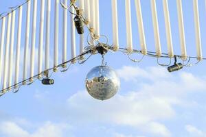 Stroboscope hanging on the wires. Stroboscope for a street disco. photo