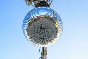 Stroboscope hanging on the wires. Stroboscope for a street disco. photo