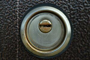 Keyhole in the iron door photo