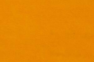 Bright orange textured felt fabric material background photo