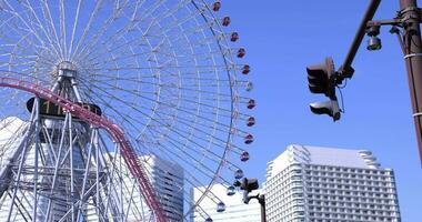 A rotating ferris wheel in Yokohama telephoto shot video