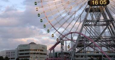 A dusk of rotating ferris wheel in Yokohama telephoto shot video