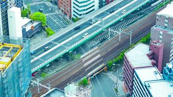 A timelapse of traffic jam on the highway in Osaka by high angle view telephoto shot tilt video