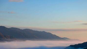 A timelapse of the sea of clouds at the top of the mountain in Kyoto telephoto shot panning video