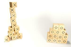 The stacks of rectangular wooden cubes to be two stacks, one high and the other short photo