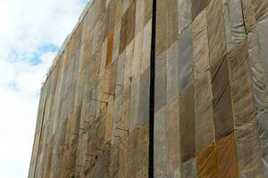 Several large canvases stretch together, Covered building under construction photo