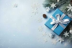 AI generated Christmas background with blue gift box, fir branches and snowflakes photo