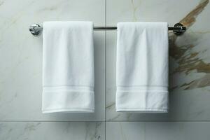 ai generado baño elegancia blanco toalla colgando en un mármol embaldosado pared baño foto