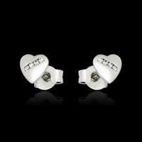 Drop earrings in the shape of heart on the black background photo