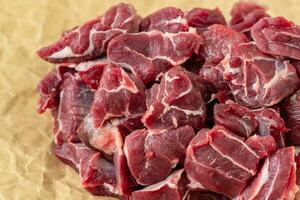 Raw breef meat on wooden table photo