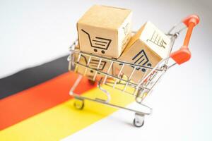 Box with shopping online cart logo and Germany flag, Import Export commerce finance delivery trade. photo