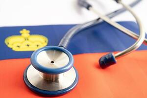 Stethoscope on Liechtenstein flag background, Business and finance concept. photo