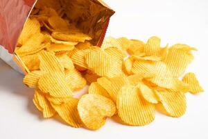 Potato chips, delicious BBQ seasoning spicy for crips, thin slice deep fried snack fast food in open bag. photo