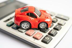 Bangkok, Thailand, September 1, 2023 Car on calculator, buying, loan or accident insurance concept. photo