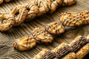 Various cookies on old wooden table photo