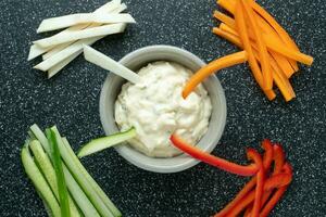 Vegetable sticks and dips in bowl. Healthy vegetables and dip snack. photo