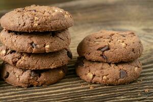 Various tasty cookies biscuits on wooden background photo