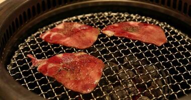 Japanese style bbq Yakiniku with Wagyu beef sliced close up handheld shot video