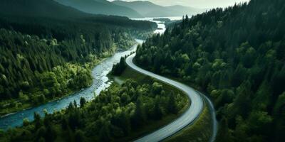 AI generated Aerial view of a road winding through a dense forest and running alongside a lake photo