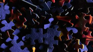 Background of Colored Puzzle Pieces that Slowly Rotating Counterclockwise - Top View, Close-Up. Texture of Incomplete Red and Blue Jigsaw Puzzle with Low Key Light - Left Rotation video