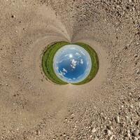 blue hole sphere little planet inside gravel sand round frame background photo