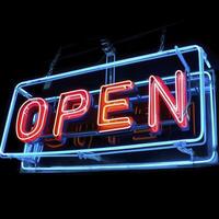 AI generated Neon vibrant OPEN text sign isolated on black photo