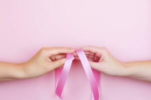 AI generated Healthcare, people and medicine concept - close-up of women's hands with cancer awareness ribbons. photo