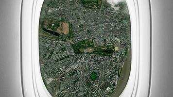 Satellite London map background loop. Airplane salon passenger seat window view. Spinning around United Kingdom city plane cabin air footage. Seamless panorama flies over terrain backdrop. video