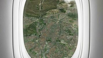 Satellite Madrid map background loop. Airplane salon passenger seat window view. Spinning around Spain city plane cabin air footage. Seamless panorama flies over terrain backdrop. video