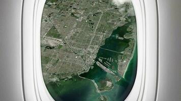 Satellite Miami map background loop. Airplane salon passenger seat window view. Spinning around United States city plane cabin air footage. Seamless panorama flies over terrain backdrop. video