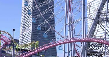 A rotating ferris wheel in Yokohama telephoto shot video