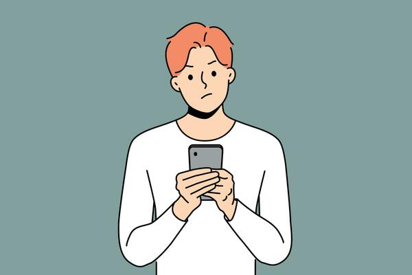 Pensive man with phone received warning text message with threat or bad news about storm warning. Confused young guy with disbelief reads spam sms in smartphone being skeptical about sender