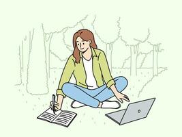 Woman student is sitting on lawn making notes in notebook and using laptop enjoying working in park. Happy girl student watching educational video and writing notes located in park vector