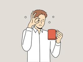 Sleepy man with mug of coffee, opens eyes with hand and needs to rest due to lack of energy and drowsiness. Tired young guy drinks coffee drink to cheer up and continue productive work. vector