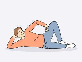 Man lies on floor with hand under head and with smile looks at screen, offering to relax and unwind. Happy guy lies on ground and smiles, feeling lazy orlacking initiative for personal growth. vector