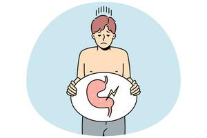 Unhealthy man suffer from indigestion problem. Unhappy sick guy holding image of sick body organ struggle with stomachache. Healthcare concept. Vector illustration.