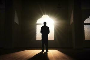AI generated silhouette muslim man praying n the mosque photo