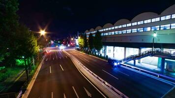 A night timelapse of traffic jam at the downtown street in Tokyo wide shot zoom video