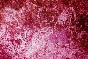 old grunge concrete wall texture or background viva magenta color of the year 2023 photo