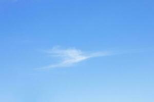 Blue sky background and white clouds soft focus, and copy space horizontal shape. photo