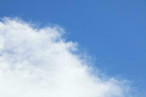 Blue sky background and white clouds soft focus, and copy space horizontal shape. photo