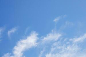Blue sky background and white clouds soft focus, and copy space horizontal shape. photo