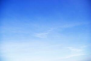 Blue sky background and white clouds soft focus, and copy space horizontal shape. photo