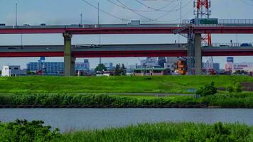 A timelapse of traffic jam at the downtown street and highway telephoto shot panning video