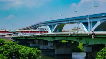 A timelapse of traffic jam at the highway and railway in Tokyo tilt video