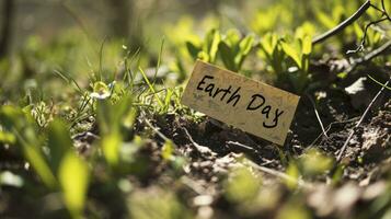 AI generated Text Earth Day written with a marker on a sticky note in a garden photo