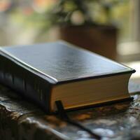 AI generated Close up view of a black book on a wooden table photo