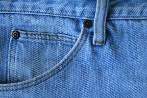 Blue denim Jeans texture and small pocket front side. photo